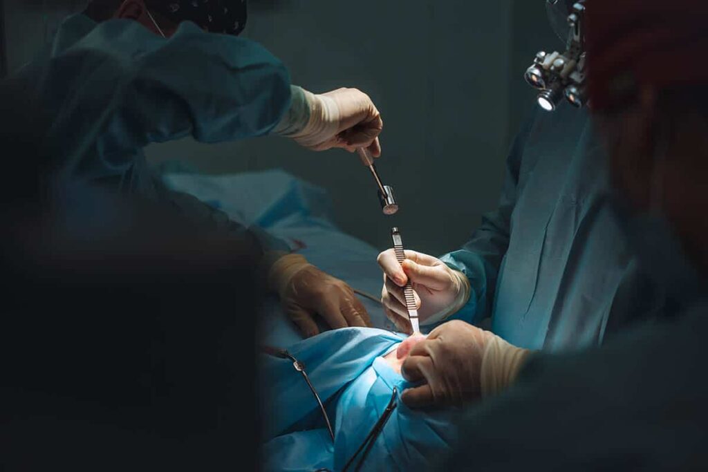 surgeon during rhinoplasty surgery