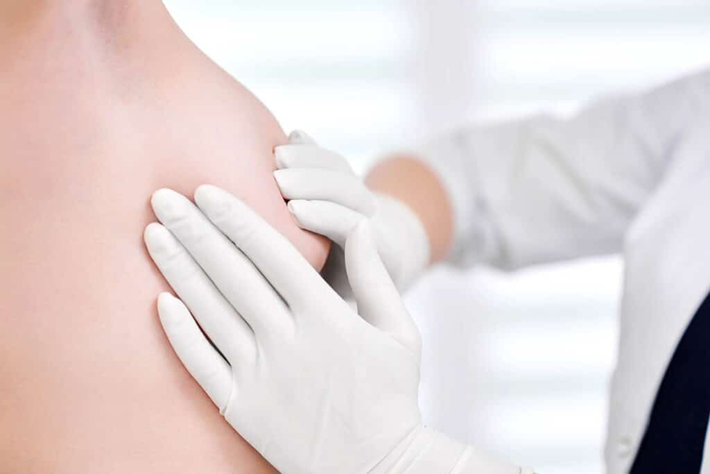 Young woman getting breast examination at the hospital