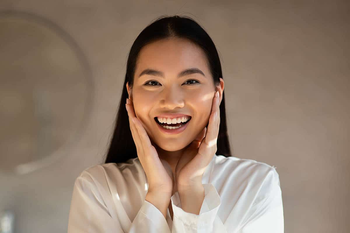 asian woman with great skin smiling