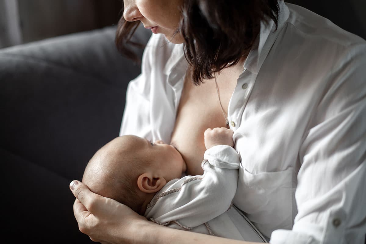 mom breastfeeds the baby
