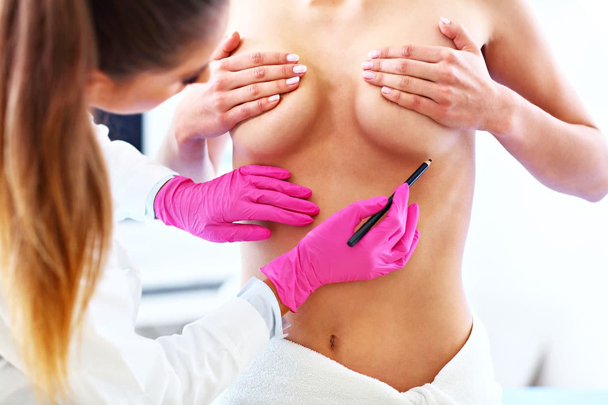 Female doctor examining breast