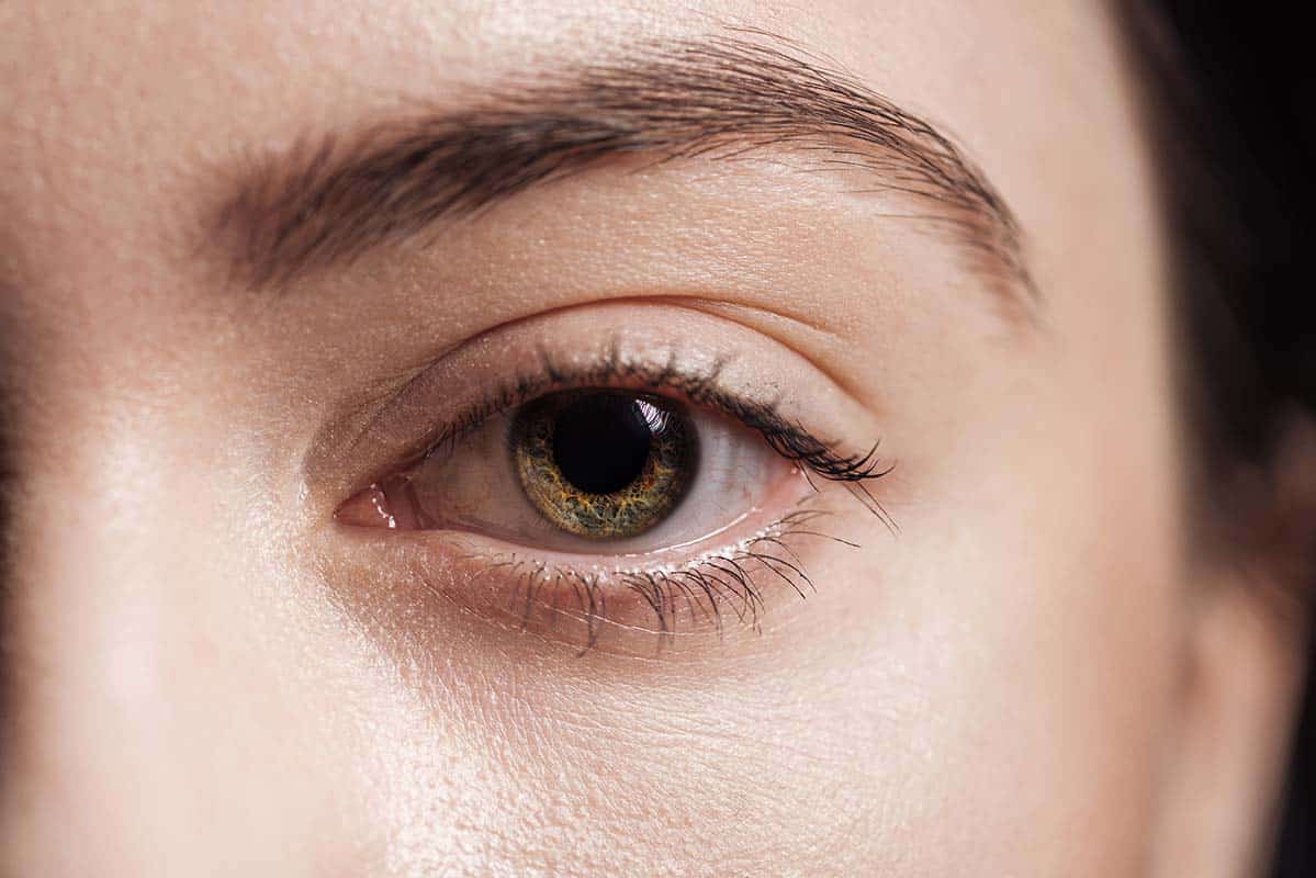 close up view of young woman eyes after fat grafting