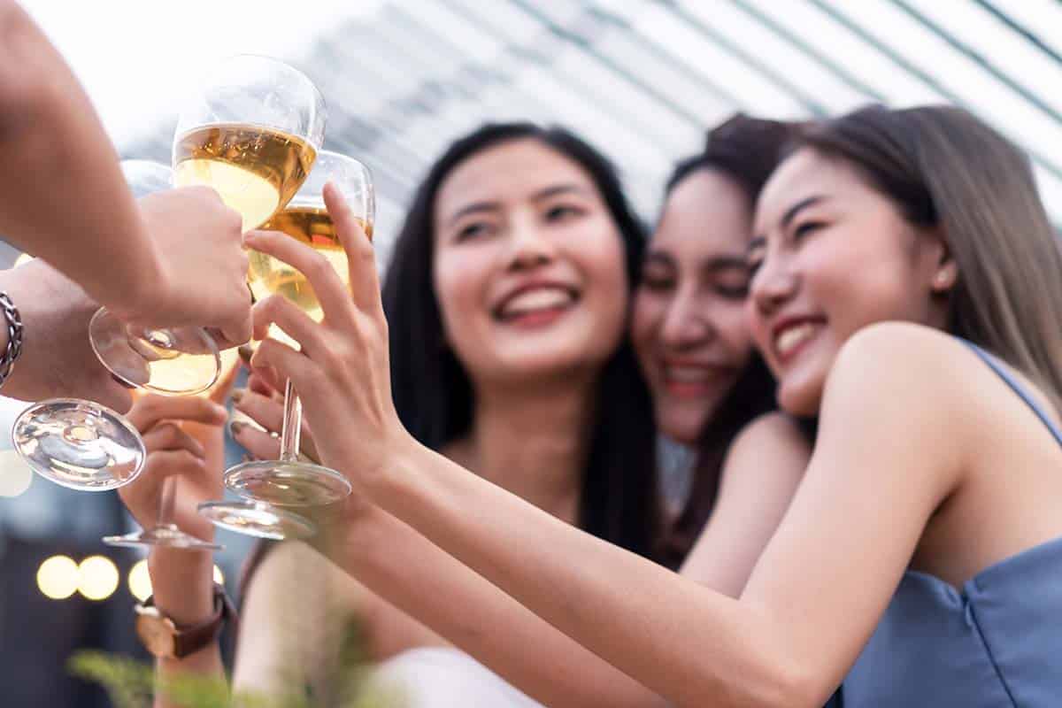 group of female friends drinking beer