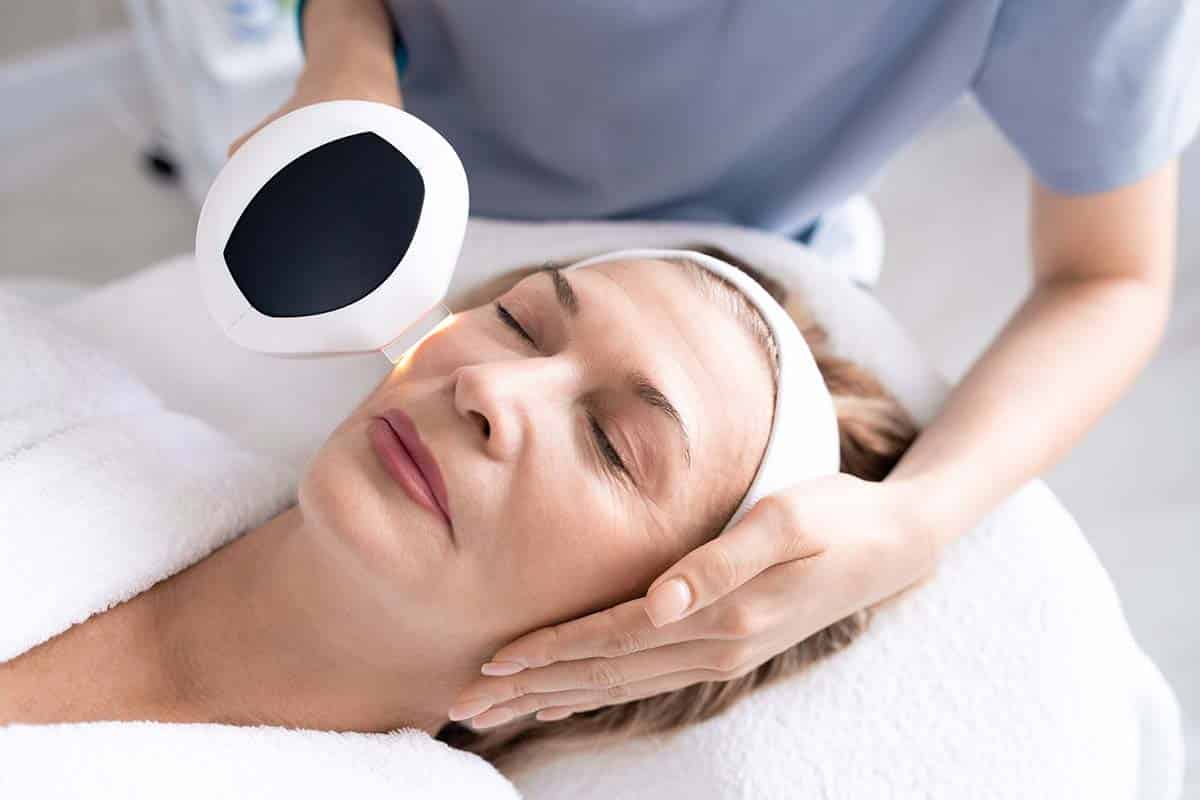 woman getting laser skin rejuvenation for under eye wrinkles and fine lines