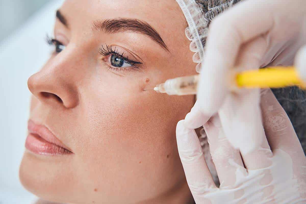 woman getting dermal fillers for under eye wrinkles